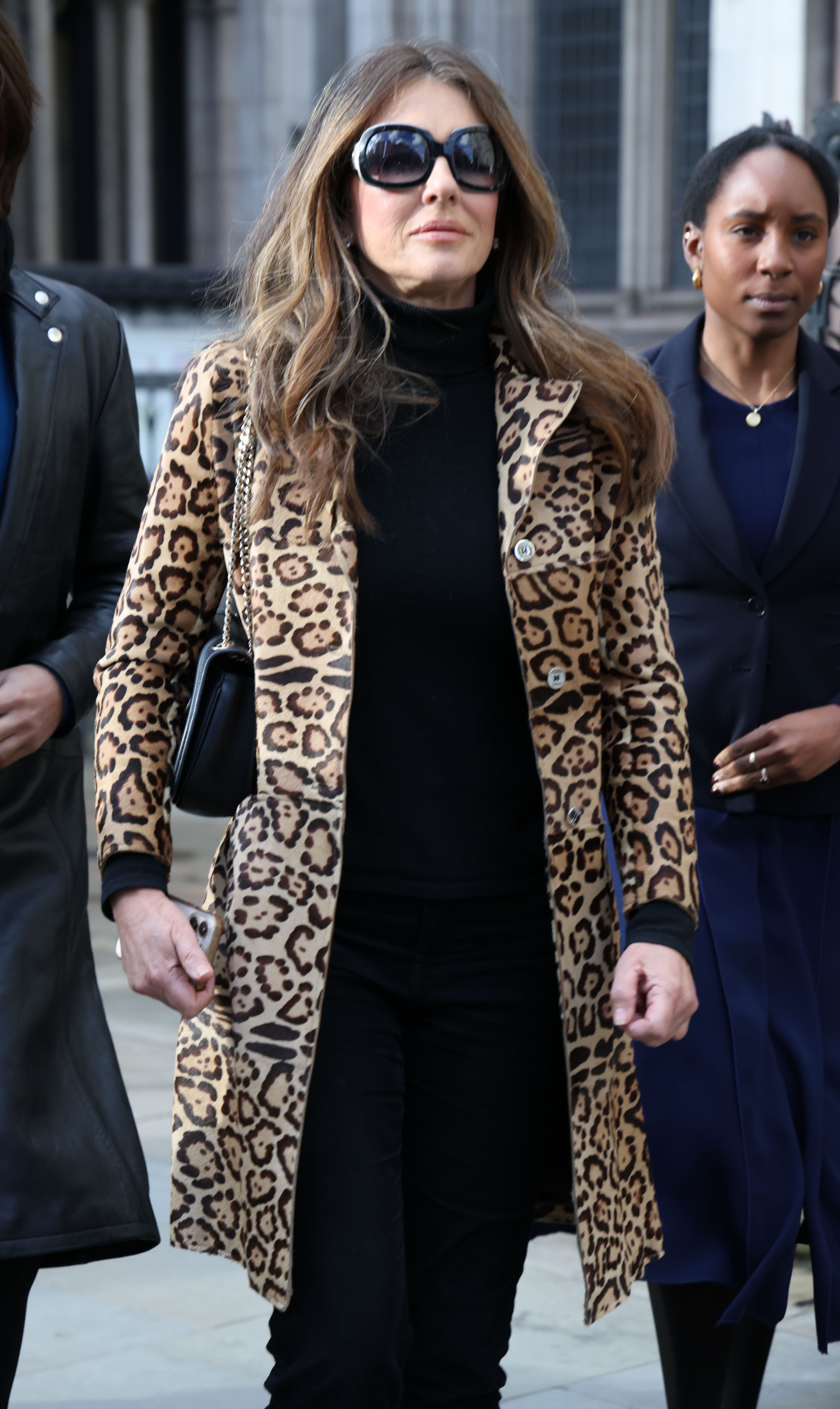 Elizabeth Hurley and Damian Hurley arrive at court during a court case against Associated Newspapers Ltd at The Royal Courts of Justice