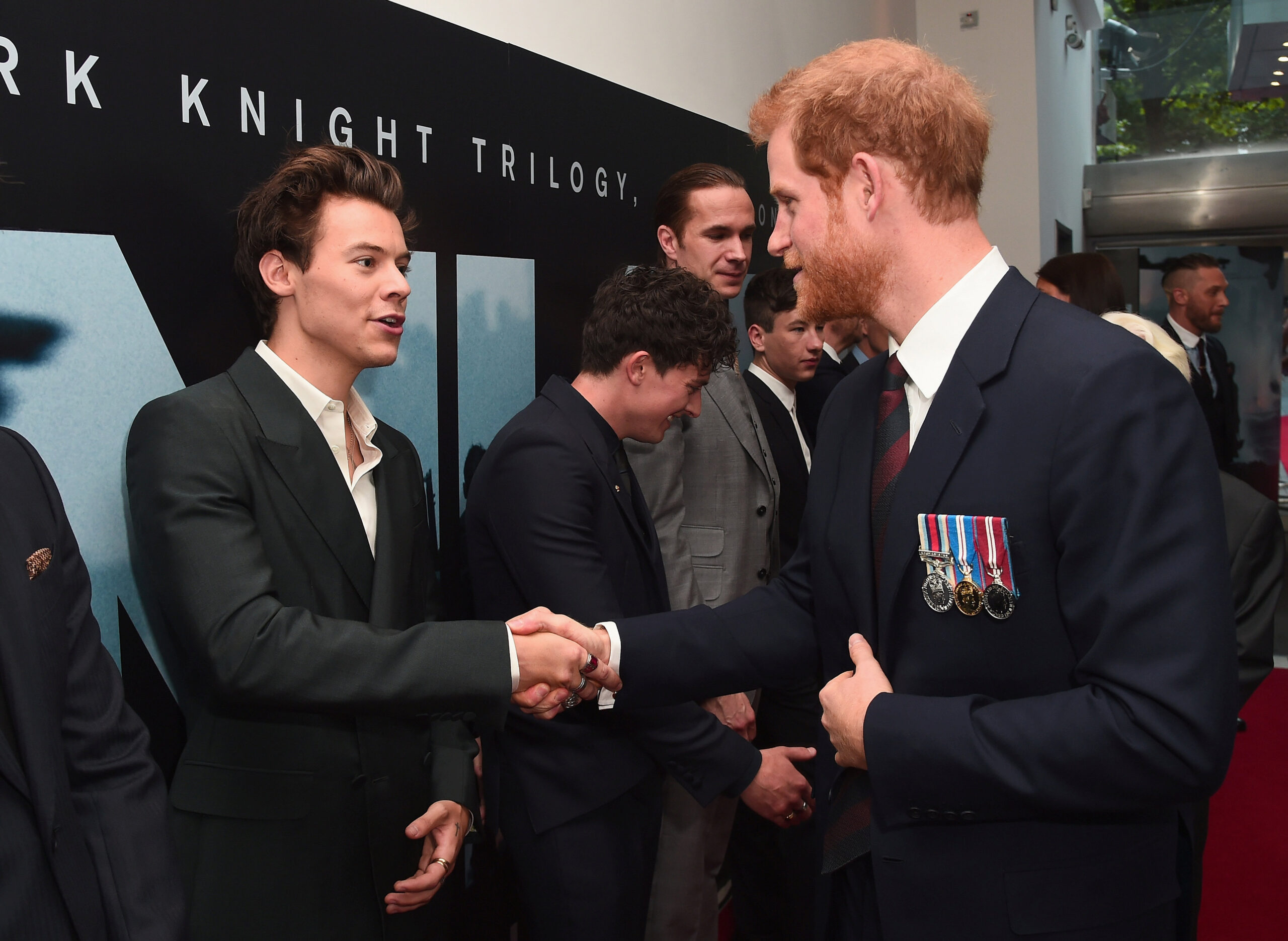 Prince Harry shaking hands with Harry Styles