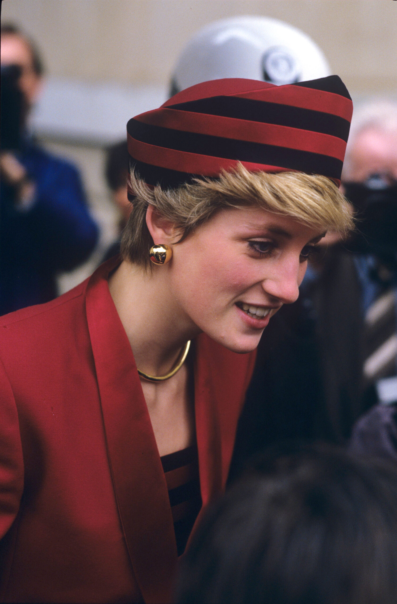 Princess Diana wearing a red ensemble