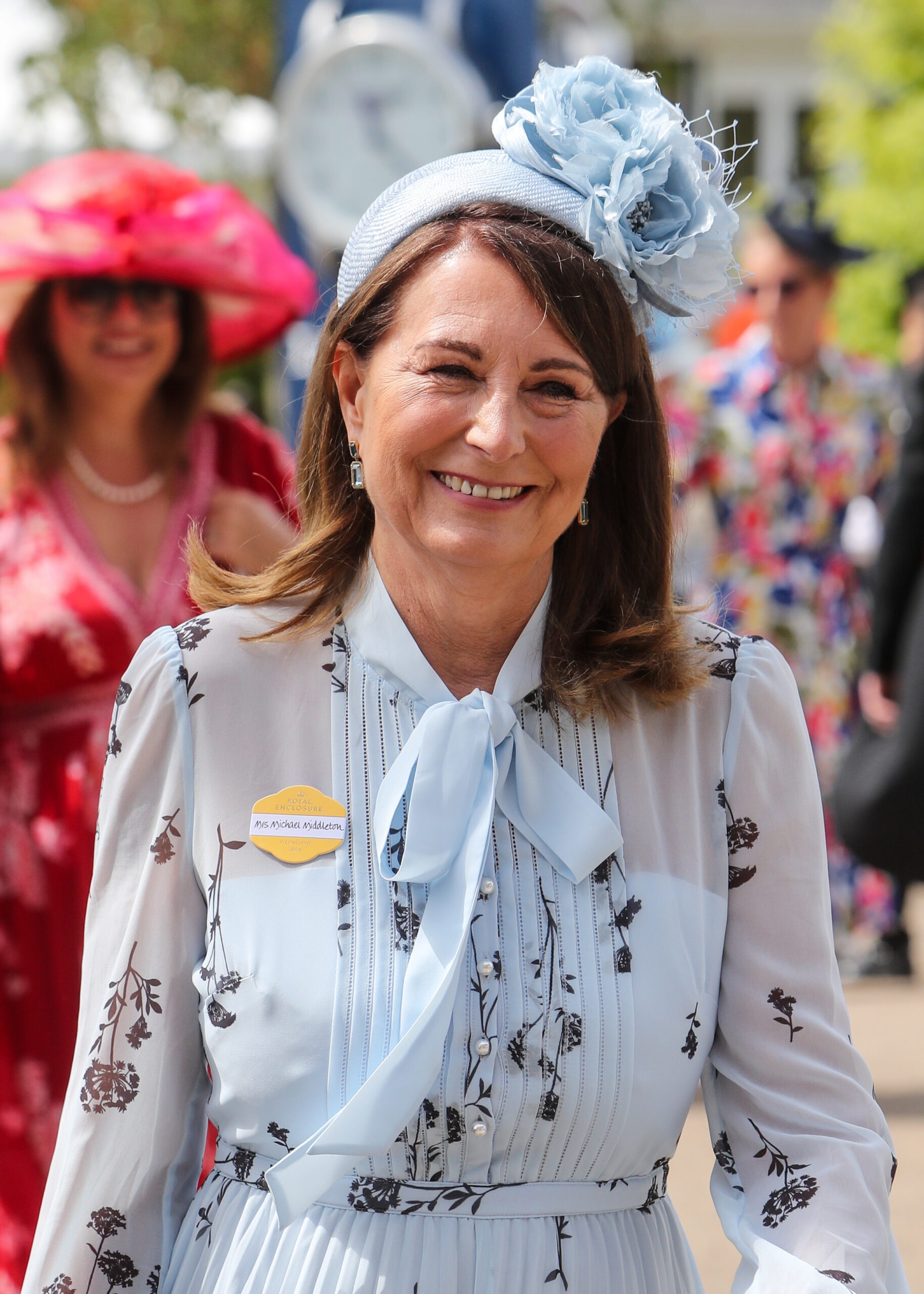 Carole Middleton smiling wearing a blue ensemble