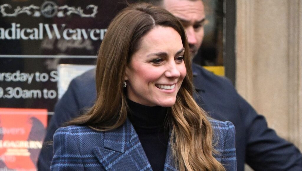 Kate Middleton smiling in tartan coat in Scotland