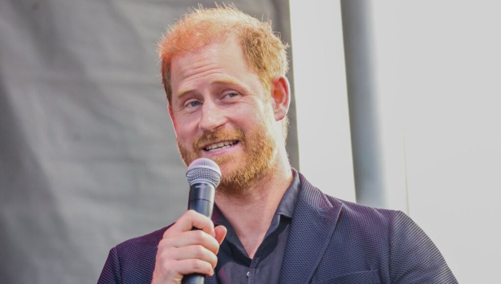 Prince Harry giving speech on stage