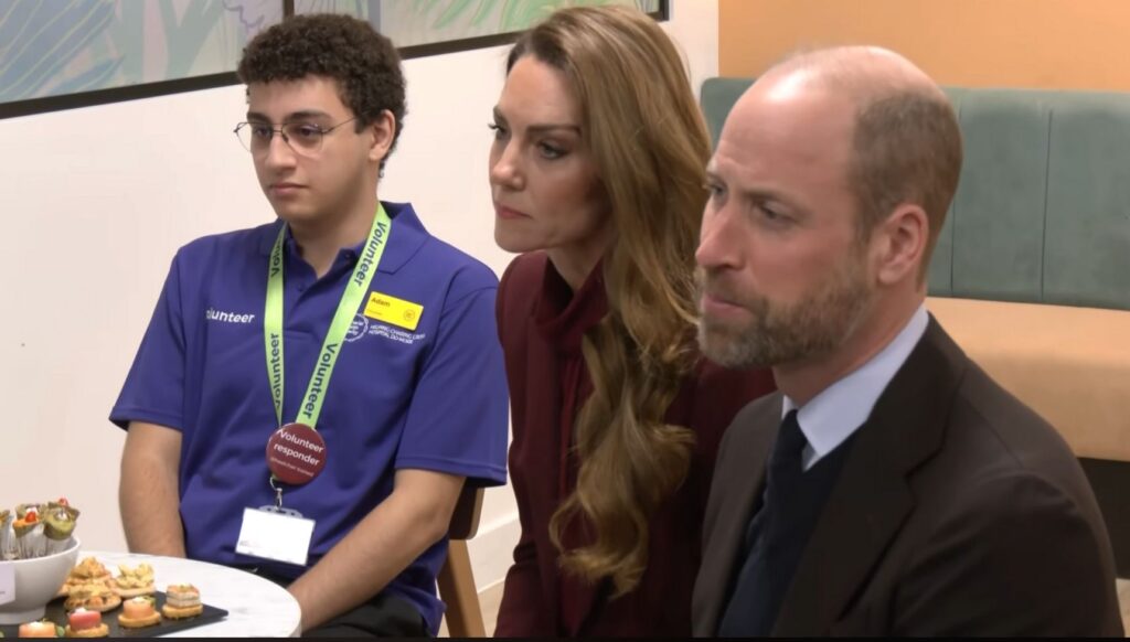 Prince William and Kate Middleton with a volunteer