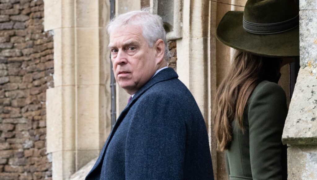 Andrew Mountbatten Windsor looking over his shoulder