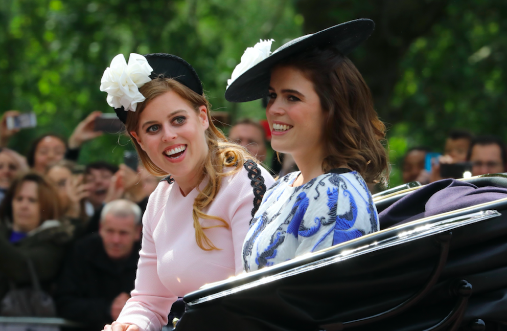 Beatrice and Eugenie at a royal event smiling