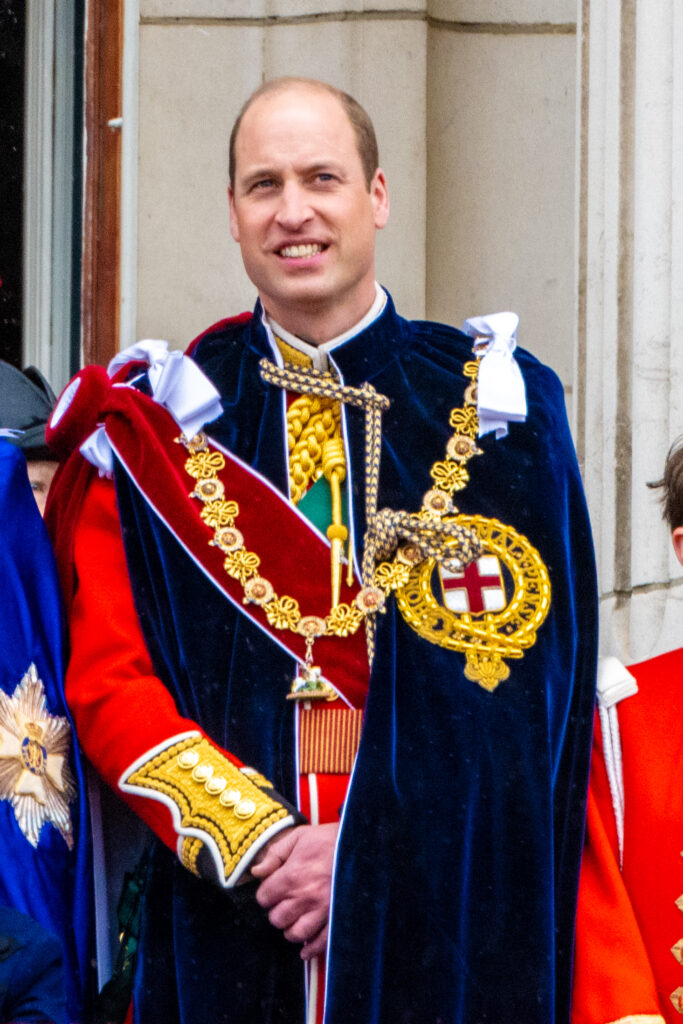 Prince William smiling at King Charles' coronation