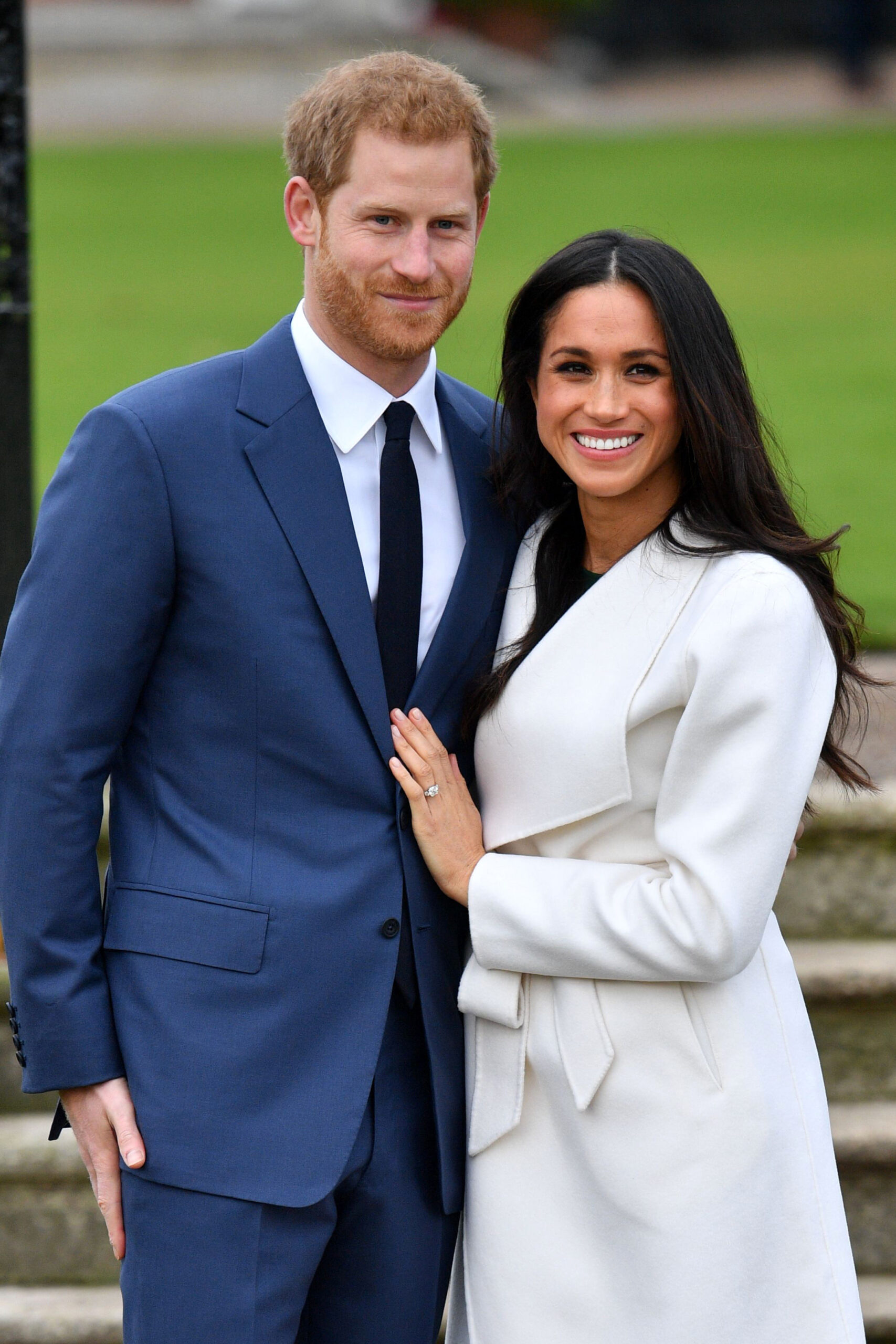 Prince Harry and Meghan Markle smiling during engagement photocall