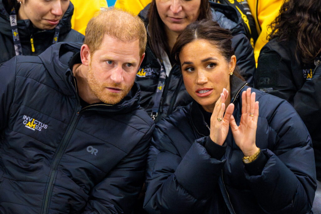 Prince Harry and Meghan Markle talking during Invictus Games