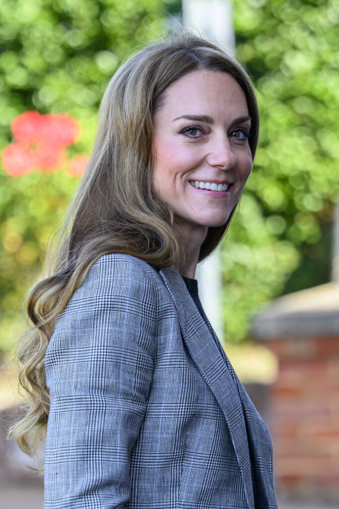 Princess of Wales smiling in grey outfit