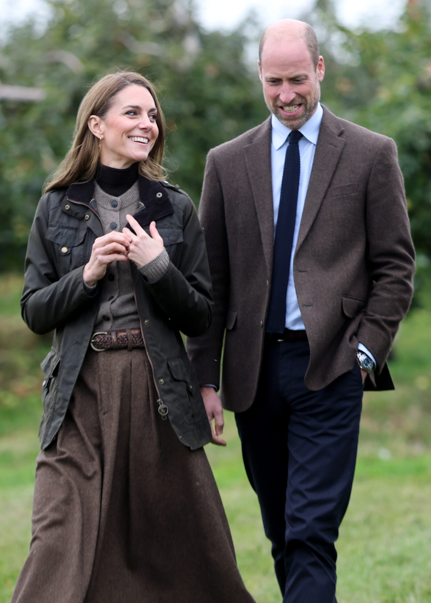 Kate Middleton smiling and looking at Prince William on royal engagement