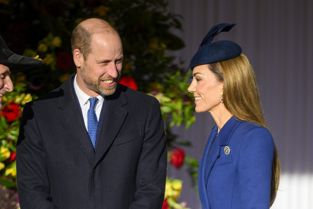Prince William and Kate Middleton smiling at each other during state visit