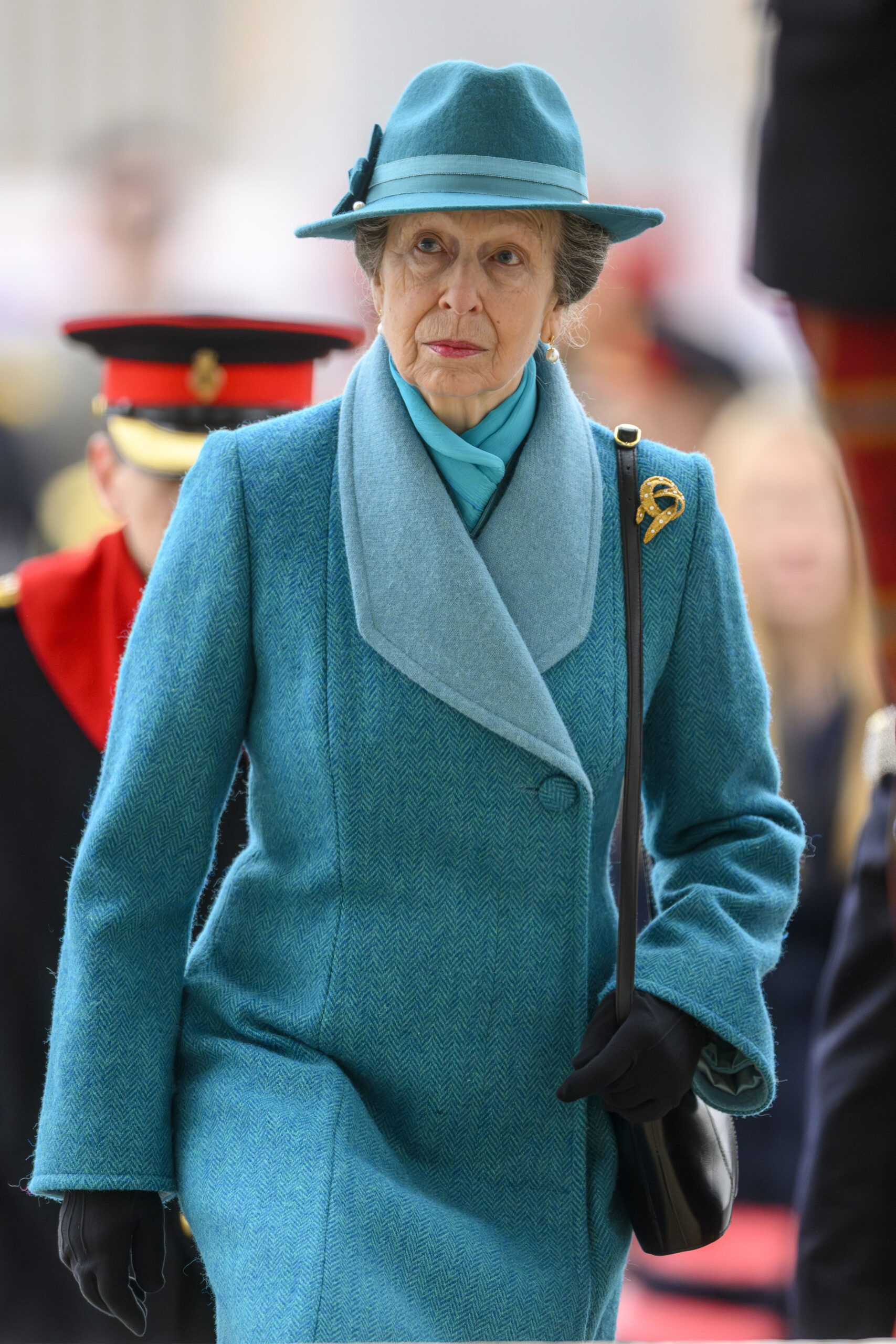 Princess Anne walking in blue coat