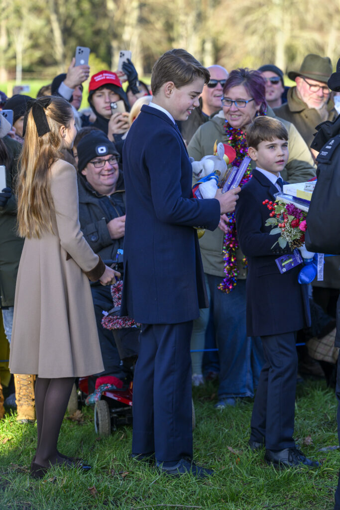 Princess Charlotte, Prince George and Prince Louis with well-wishers on Christmas Day