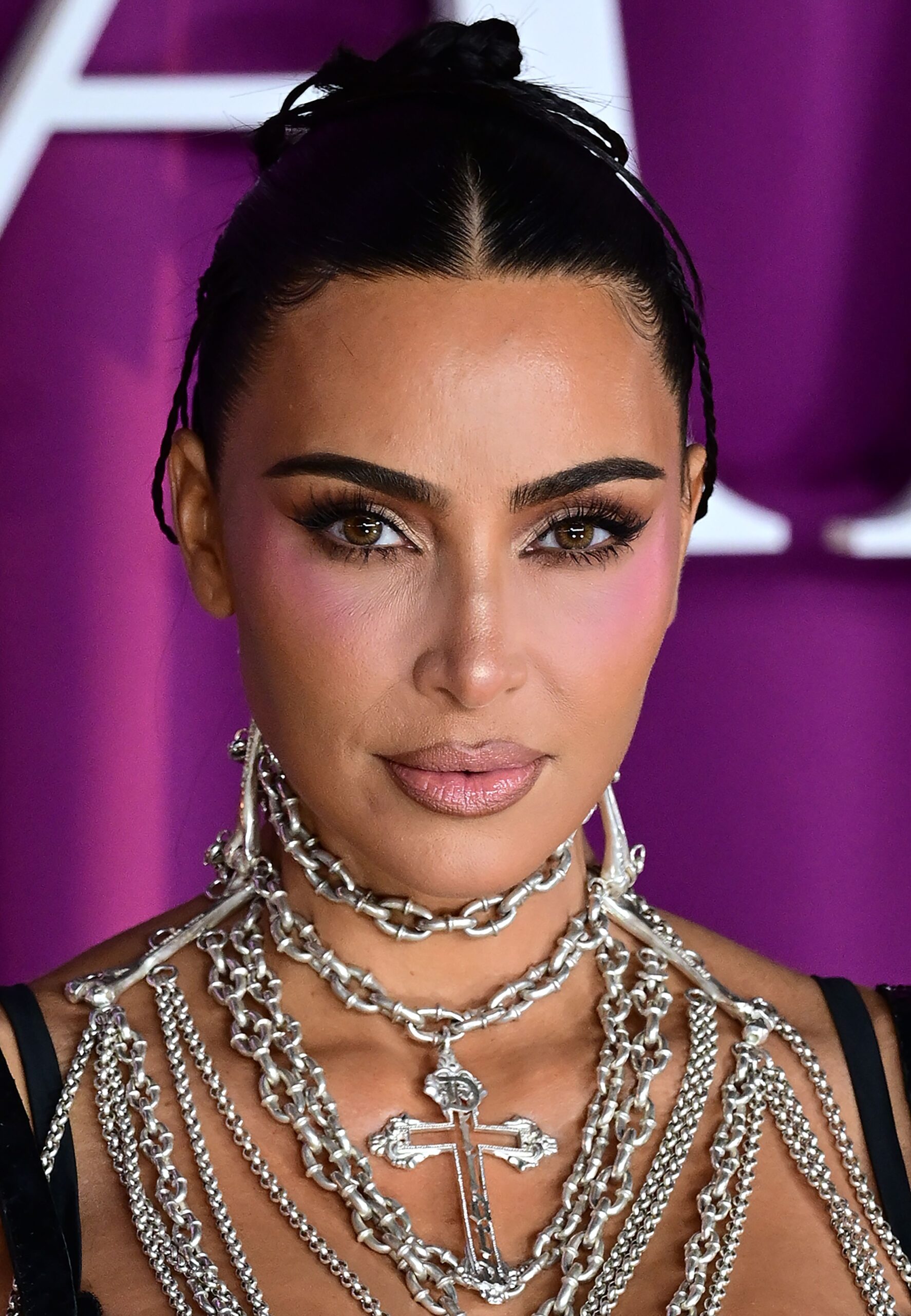 Kim Kardashian with a serious expression staring at the camera