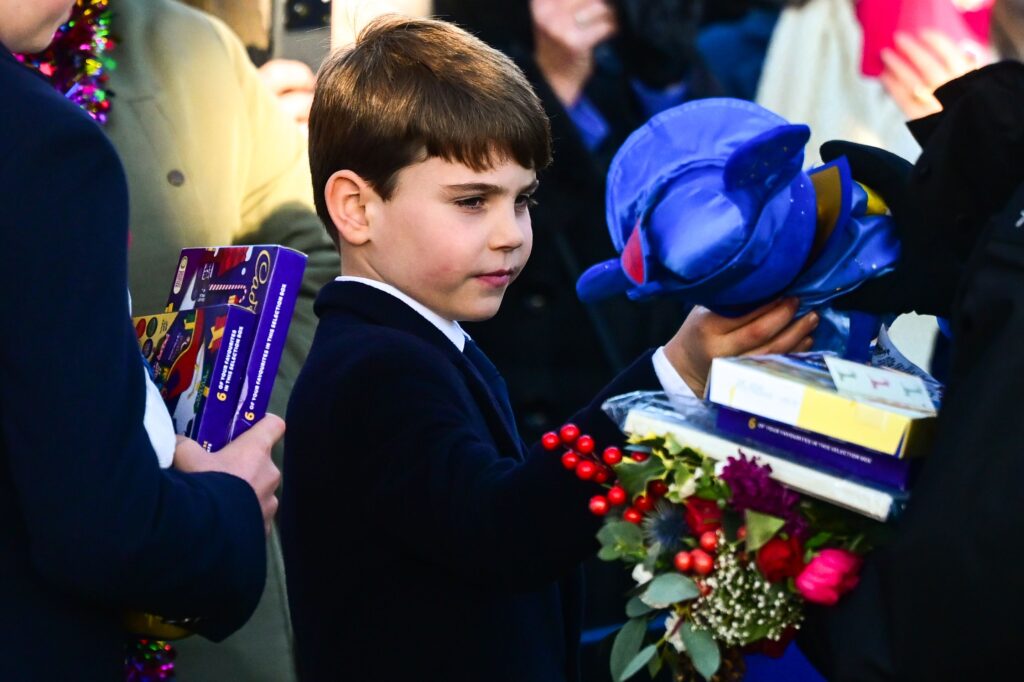 Prince Louis holding gifts on Christmas Day
