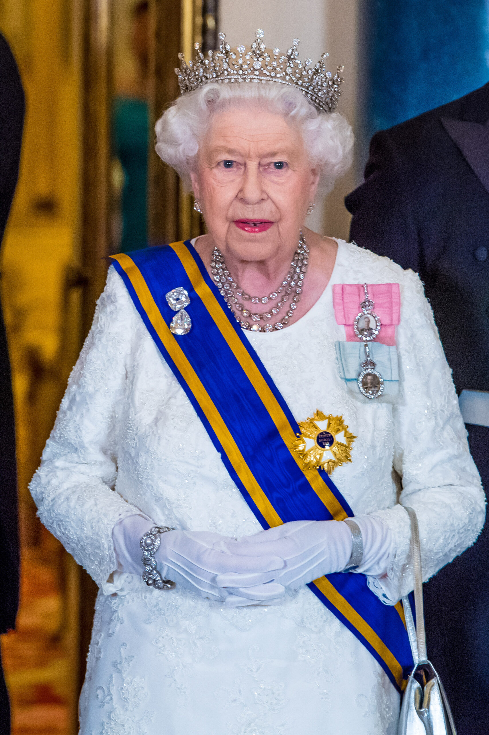 Queen Elizabeth II wearing a tiara and a white dress