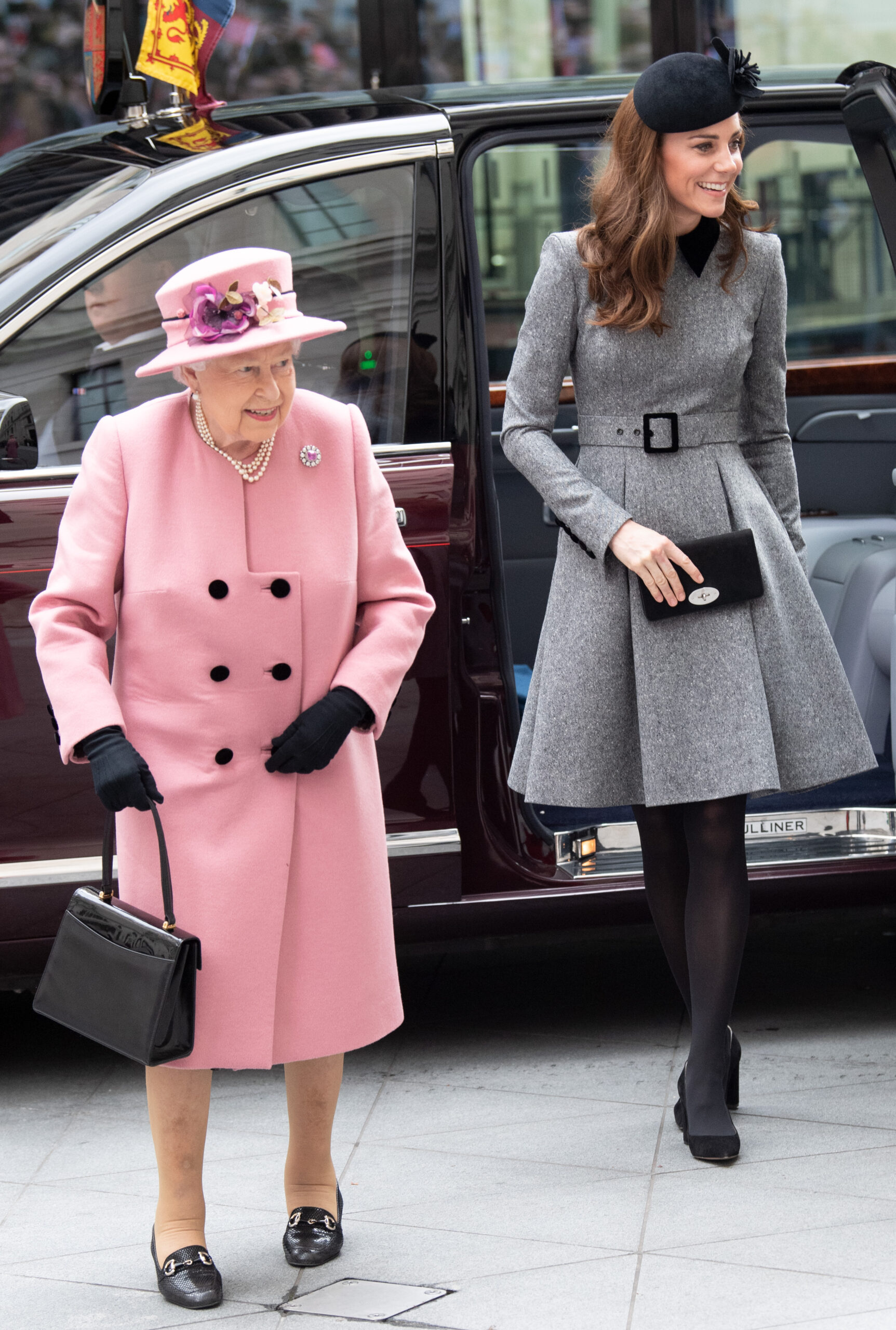 Queen Elizabeth II in pink and Kate Middleton in grey on royal engagement