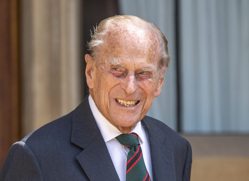 Prince Philip smiling in suit at Windsor Castle