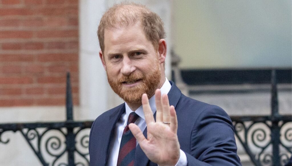 Prince Harry waving and smiling