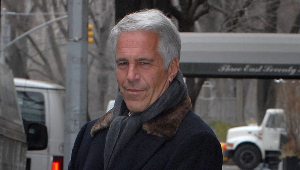 Jeffrey Epstein stood staring at the camera