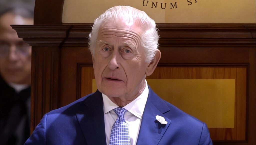 King Charles looking worried in suit in Rome