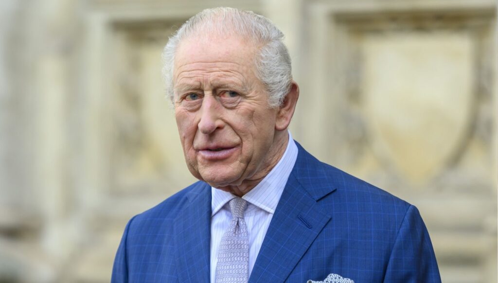 King Charles in blue suit at service