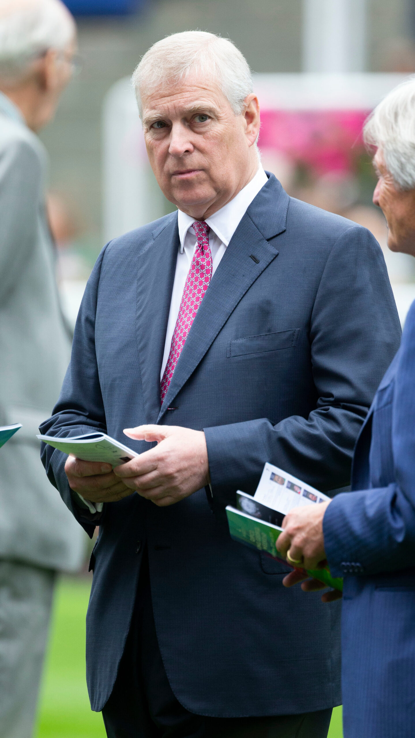 Andrew Mountbatten-Windsor frowning whilst at the races