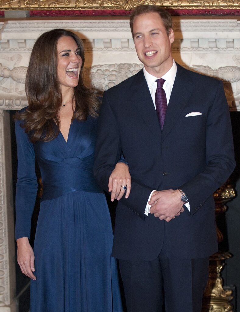 Kate Middleton and Prince William laughing and smiling together in their engagement photos