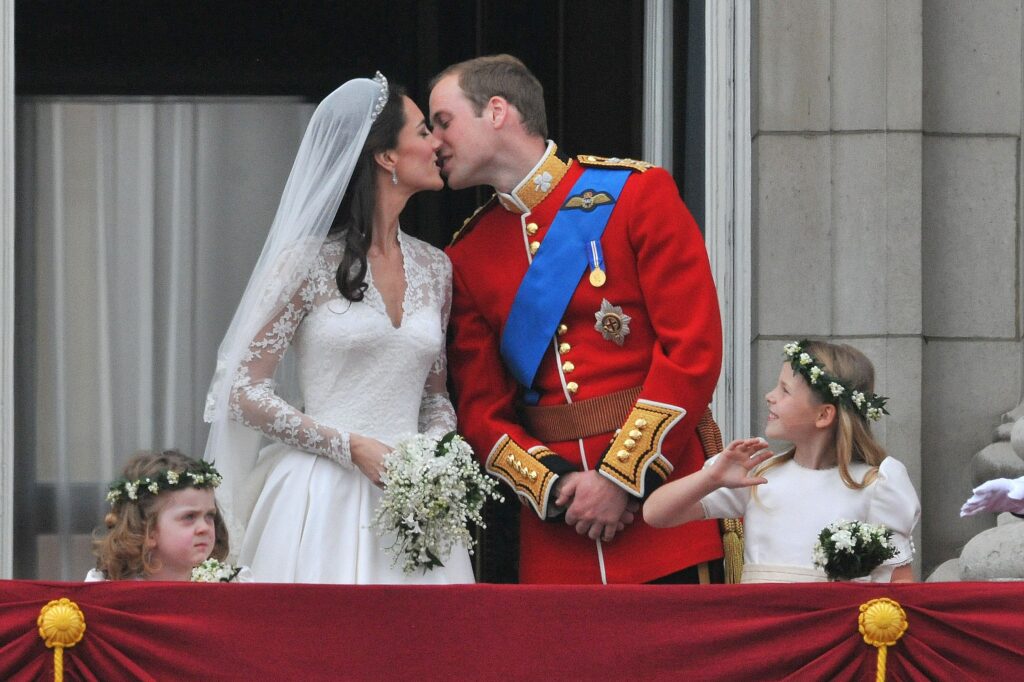 Kate Middleton and Prince William kissing on Buckingham Palace balcony on their wedding day