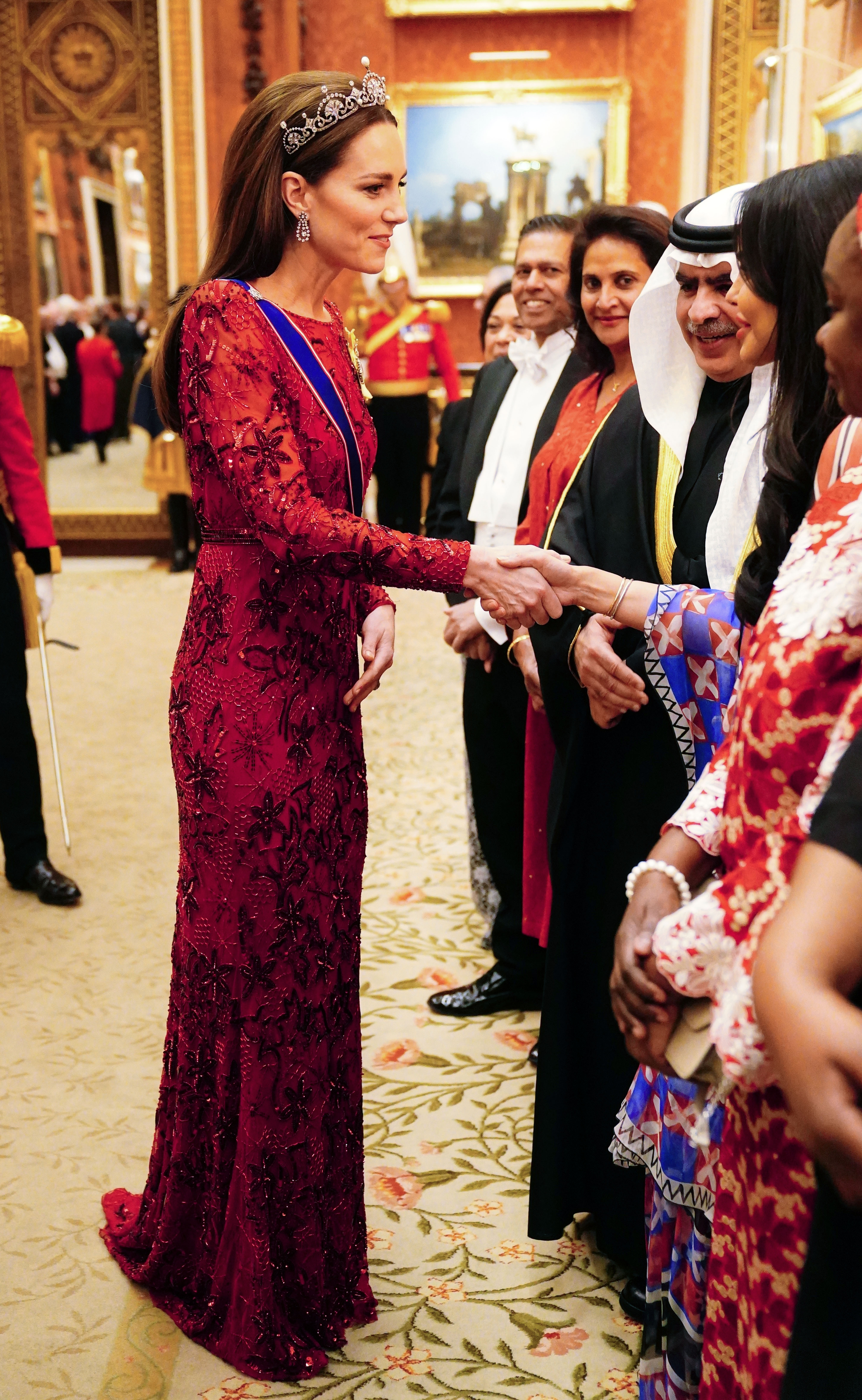 Princess Kate in a red, beaded gown by Jenny Packham