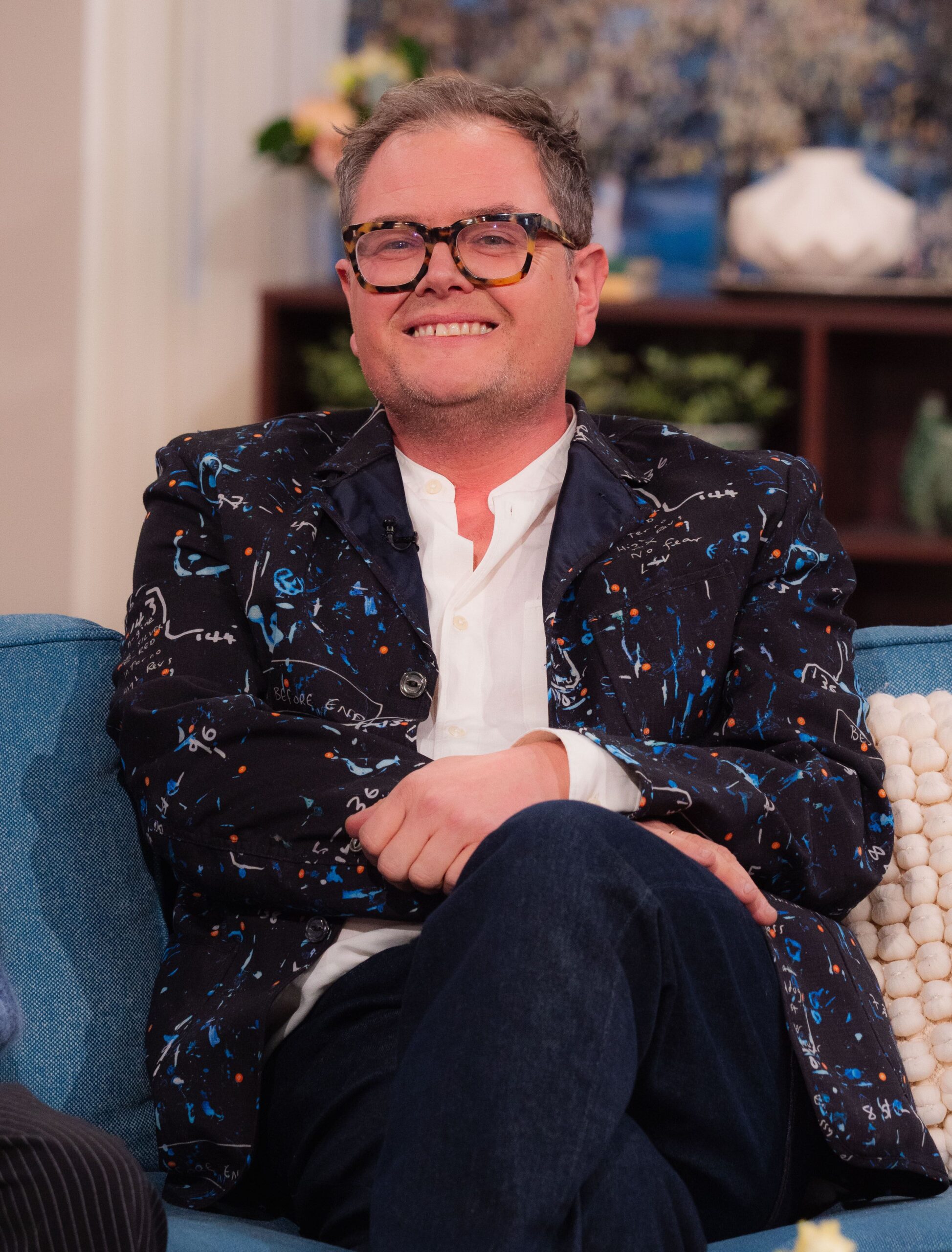 Alan Carr smiling on This Morning