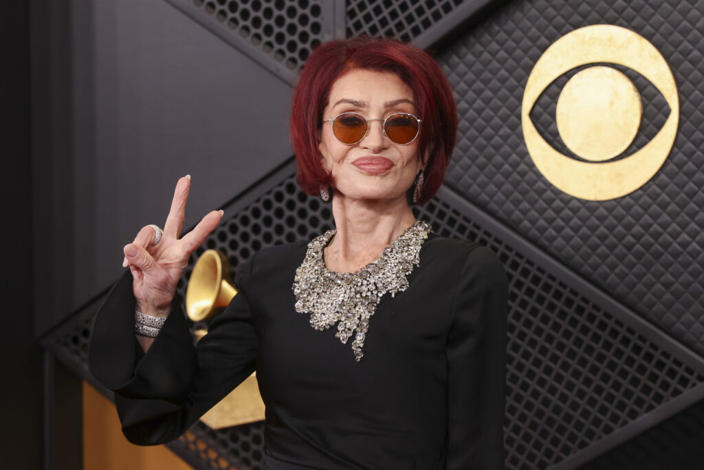 Sharon Osbourne putting up a peace sign at The Grammys