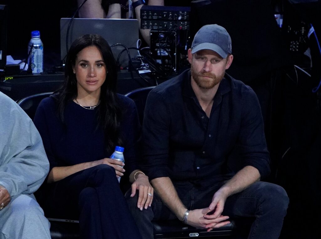 Meghan and Harry sat side by side with serious expressions