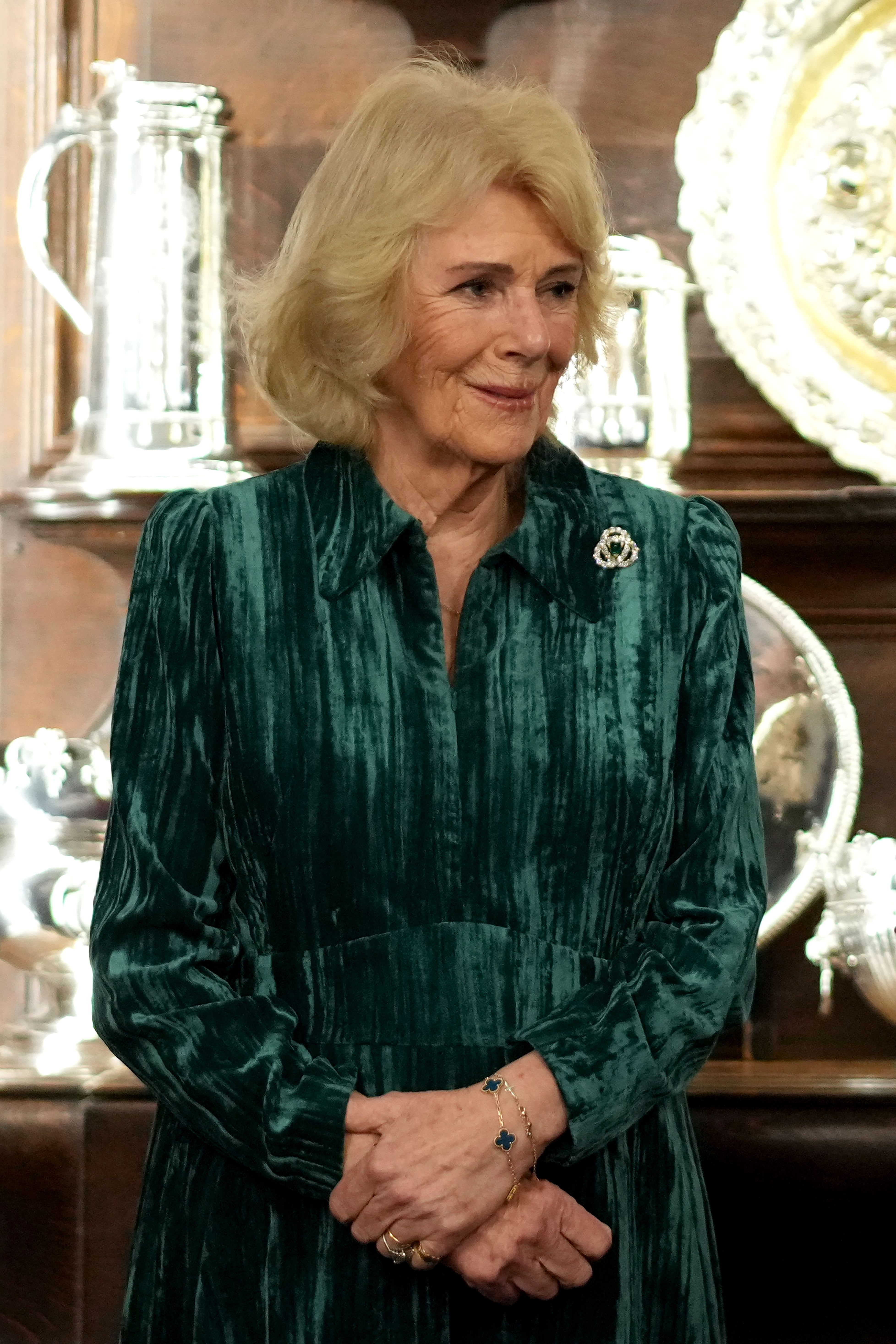 Queen Camilla photographed wearing a green velvet dress on February 18