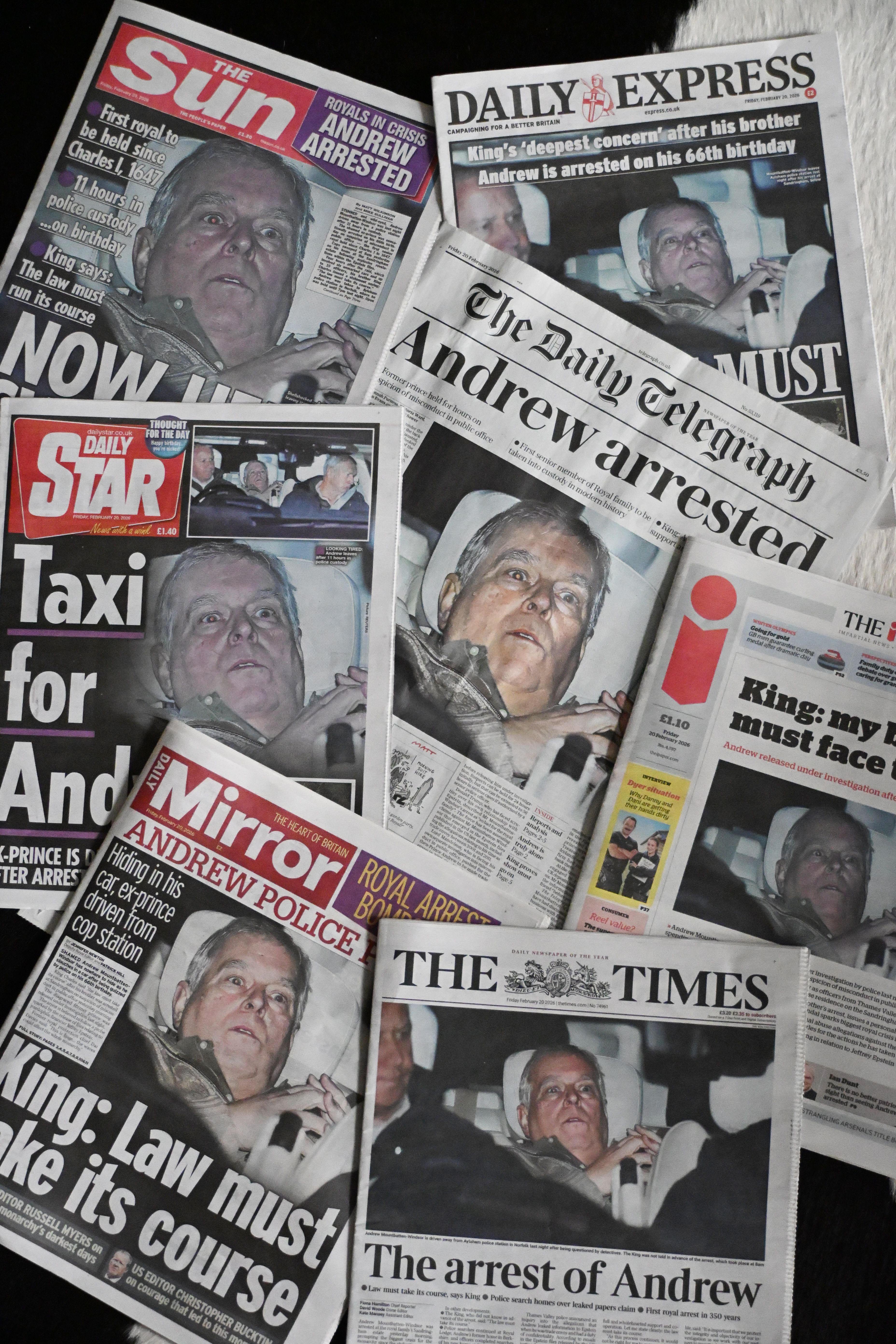 UK newspaper depicting front pages awash with an image of Andrew Mountbatten-Windsor following his arrest