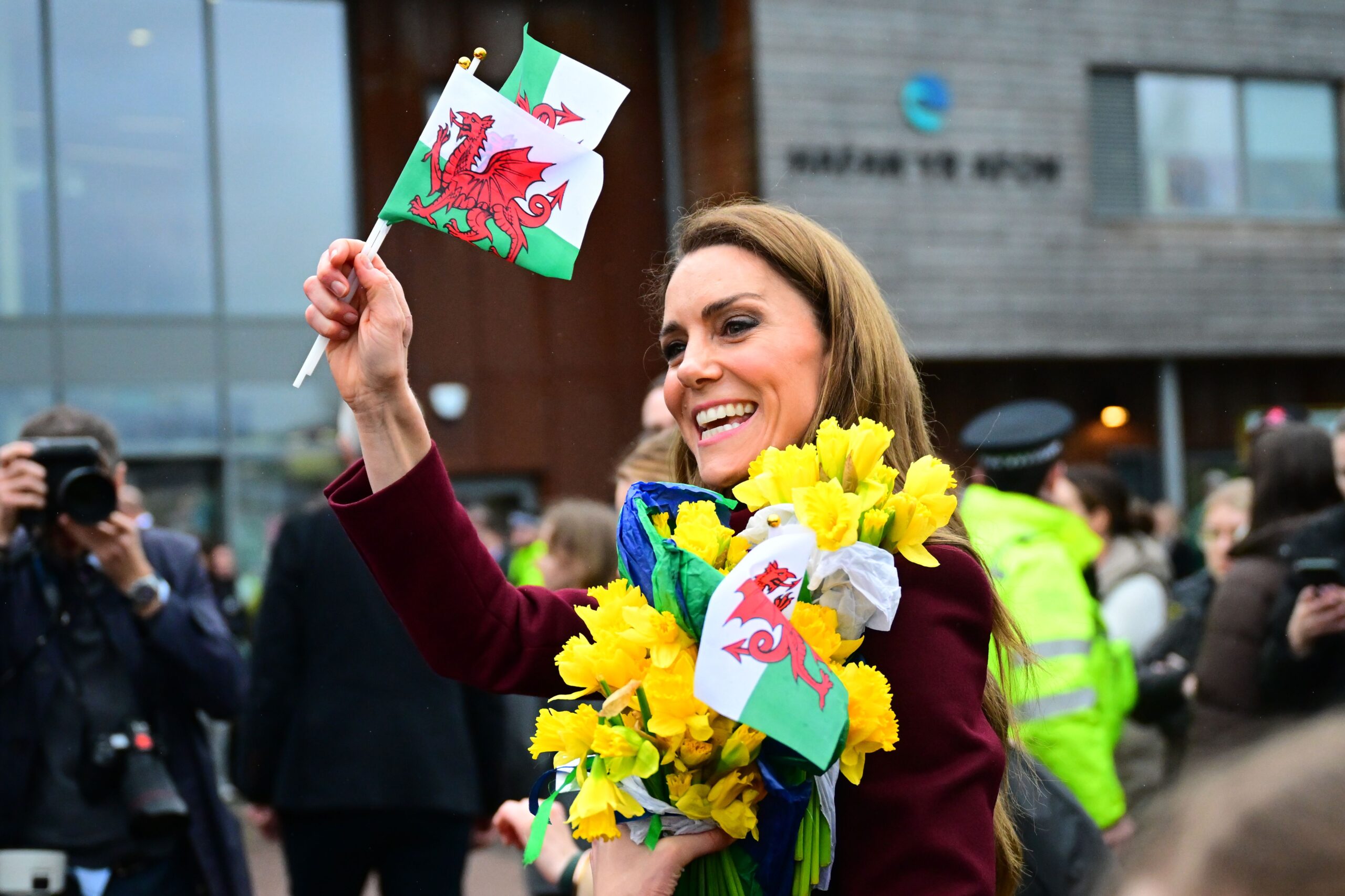 Kate Middleton waving a Welsh flag