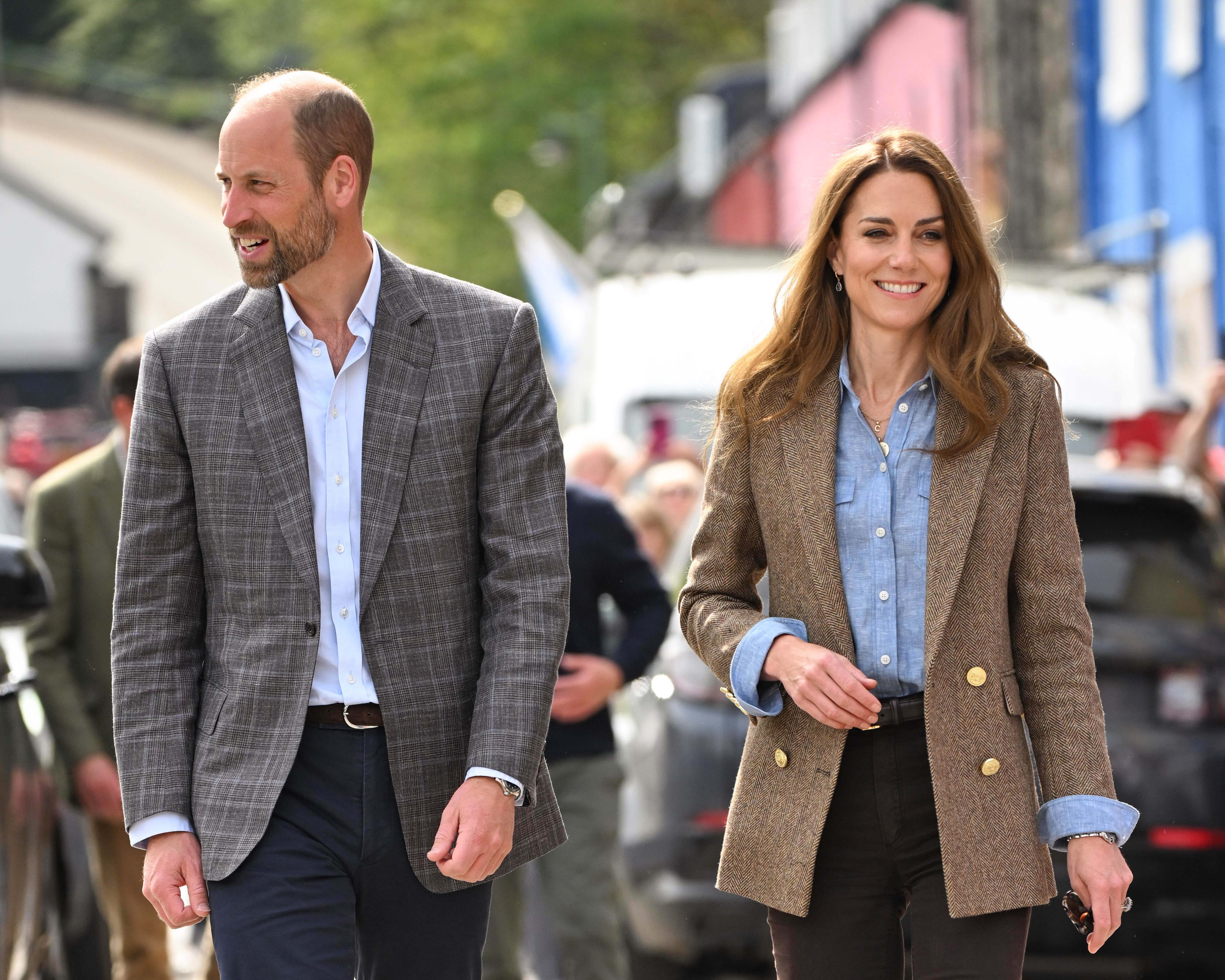 Prince William and Princess Kate smiling as they walk together