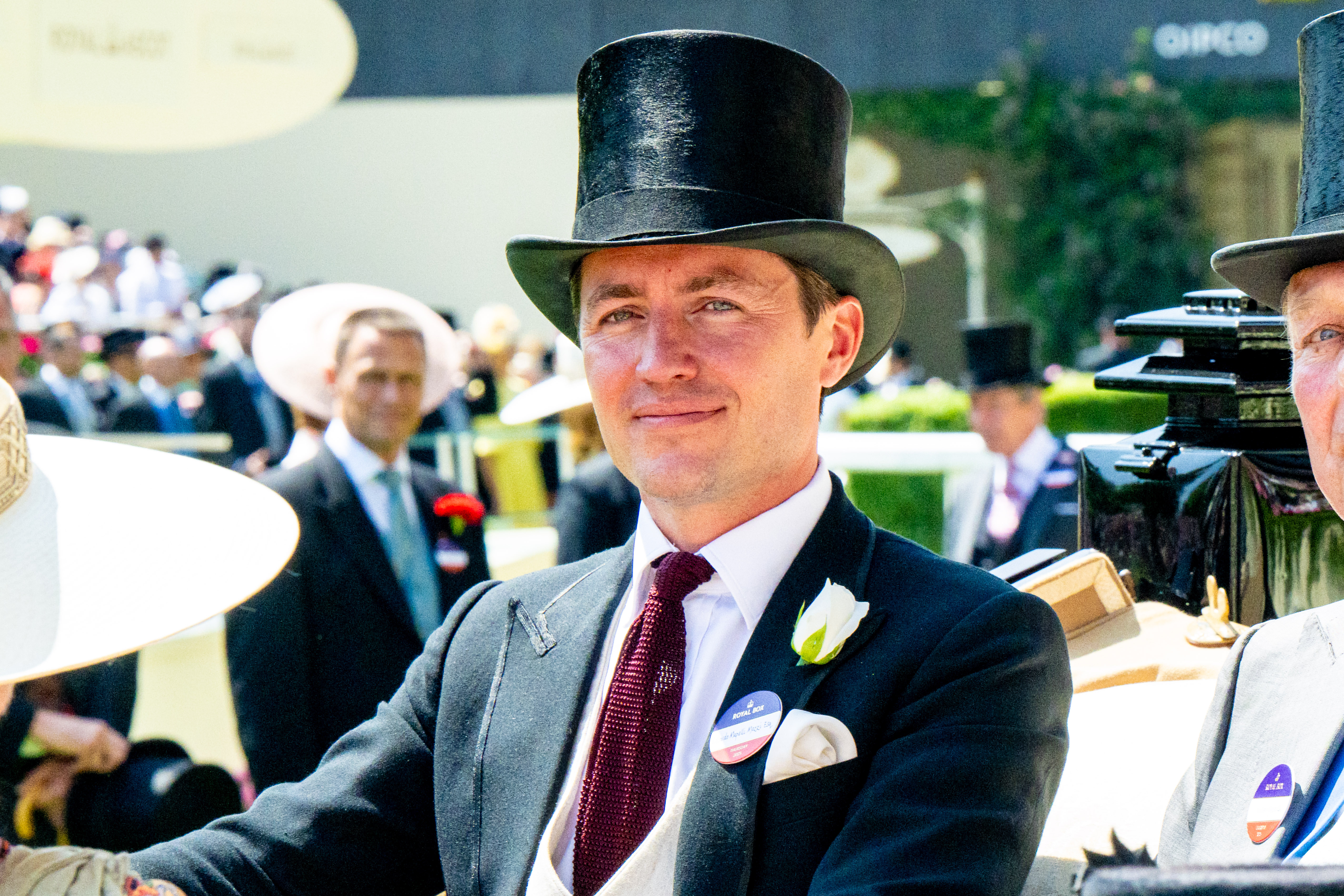 Edoardo Mapelli Mozzi wearing a top hat and smiling