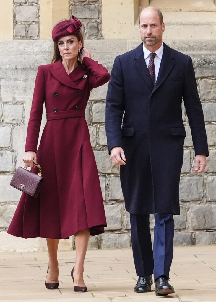 Princess Kate Middleton frowning as she walks beside Prince William