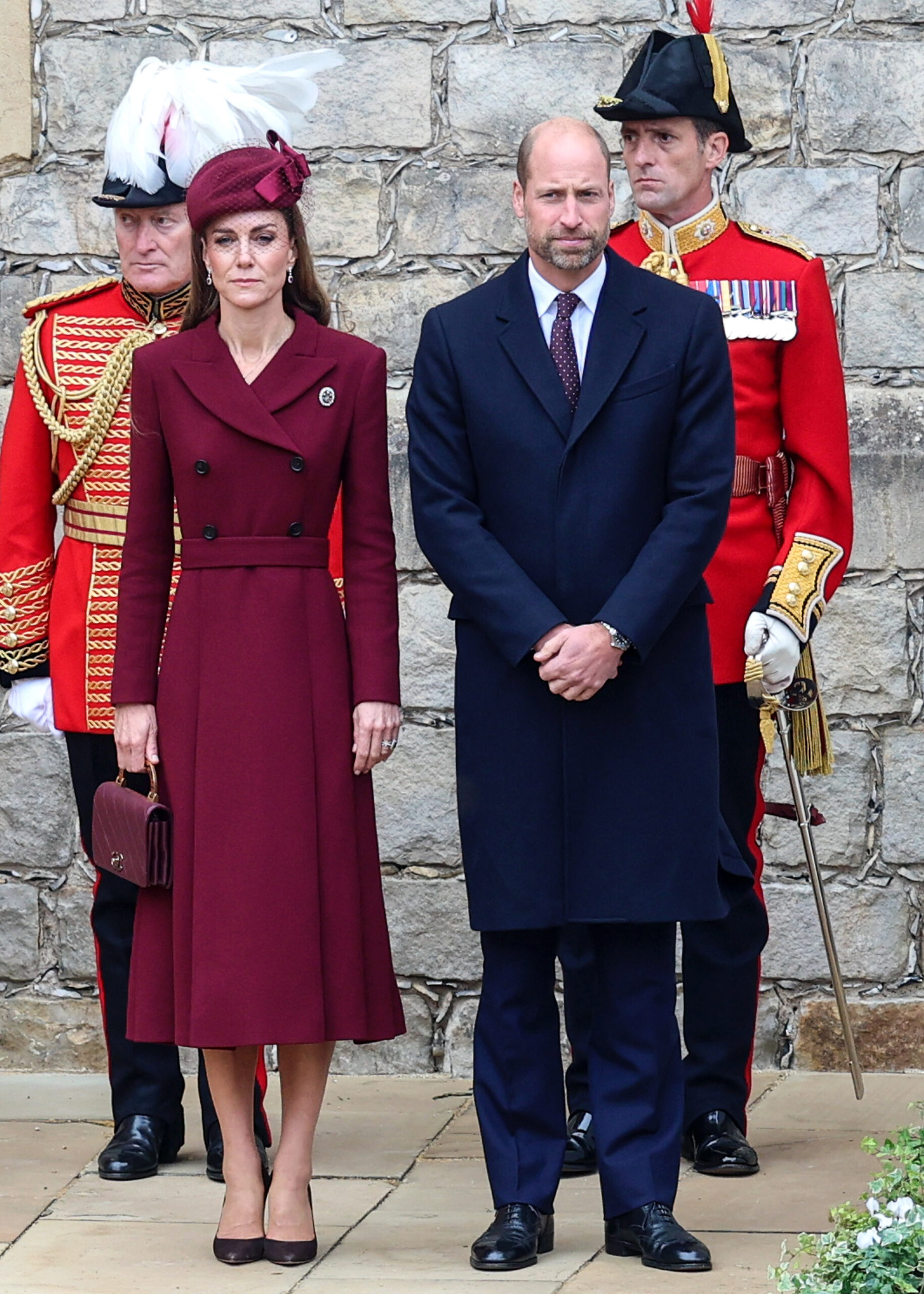 Princess Kate and Prince William frowning side by side