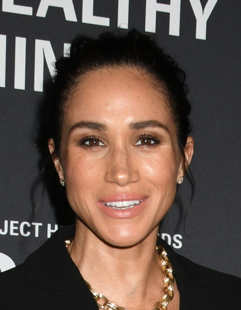 Meghan Markle smiling on the red carpet