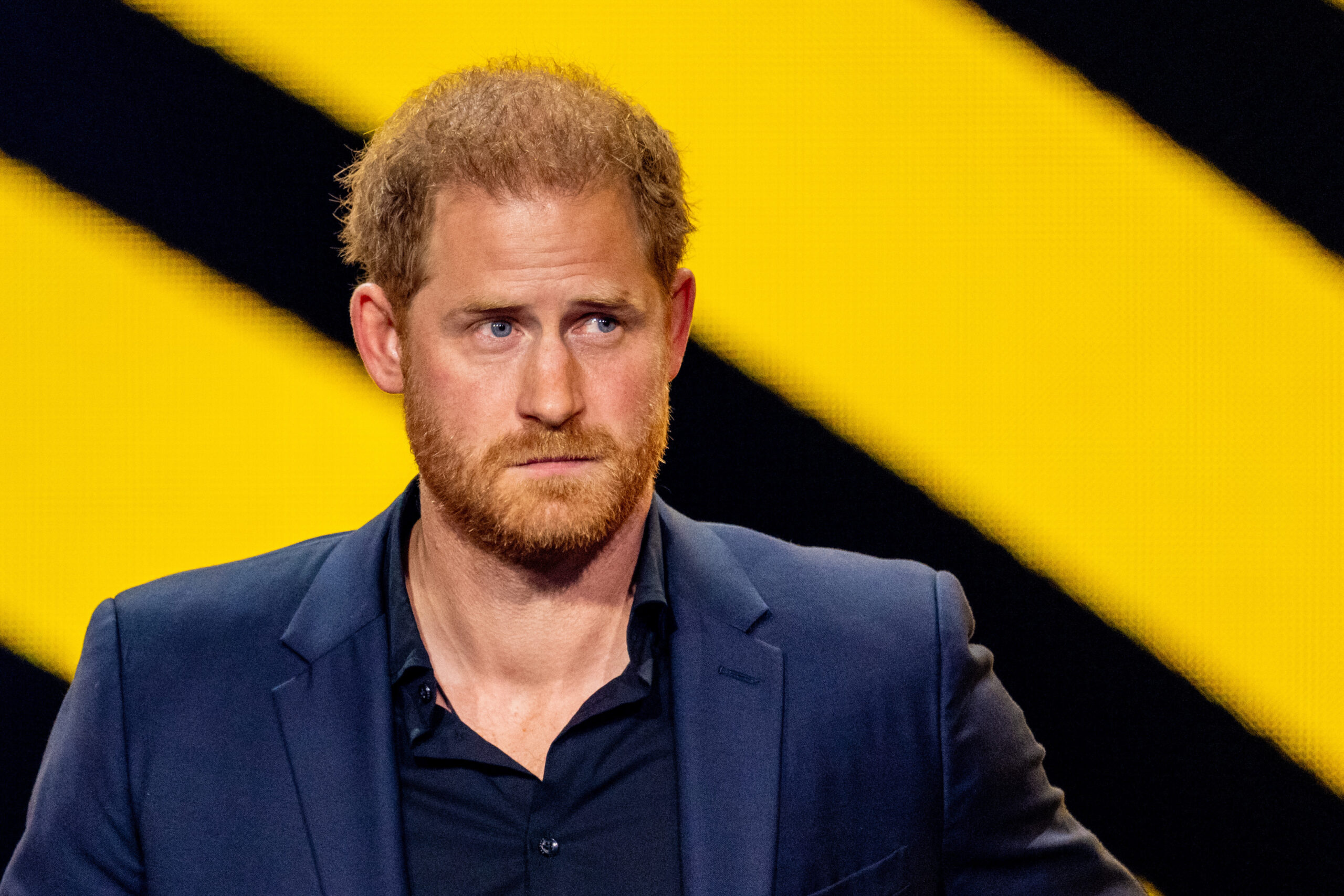 Prince Harry frowning