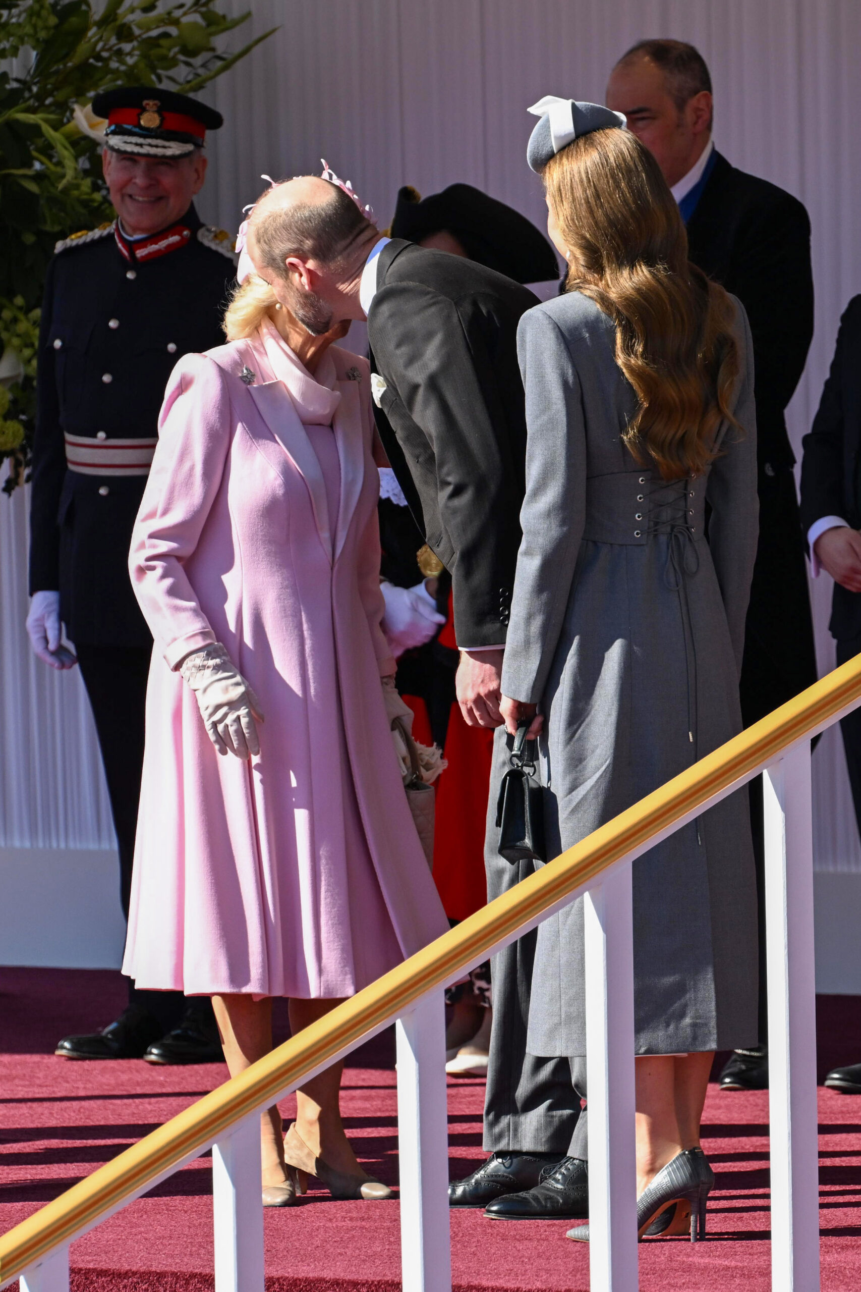 Prince William kisses Queen Camilla during state visit