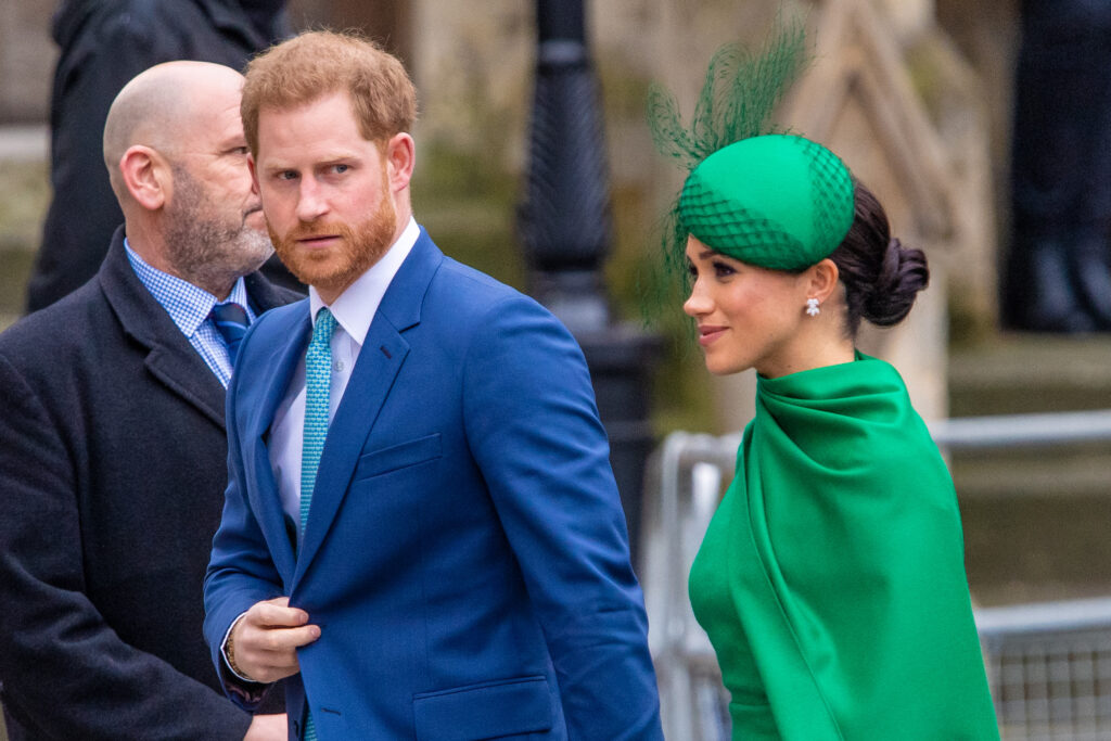 Prince Harry frowning beside Meghan Markle at the Commonwealth Day service in 2020