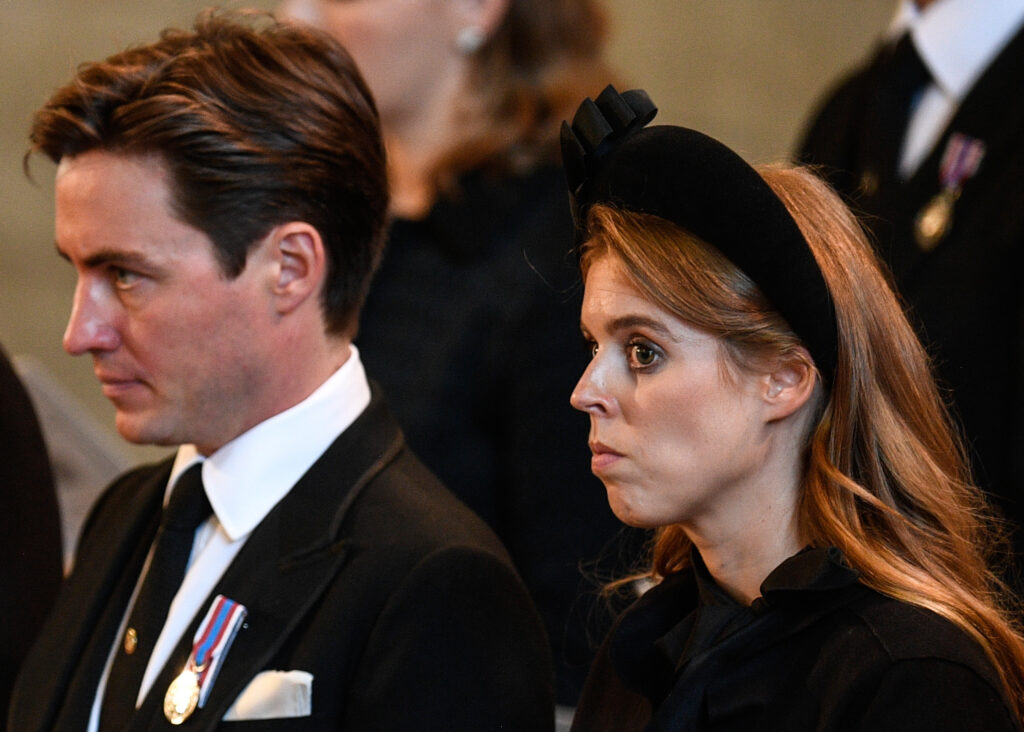 Edoardo Mapelli Mozzi and Princess Beatrice looking down and frowning