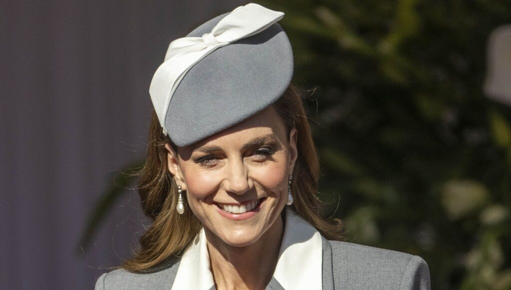 Princess Kate smiling in grey outfit for state visit