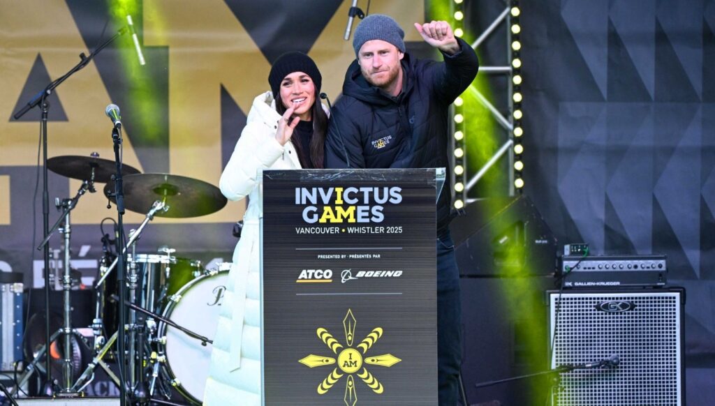 Prince Harry and Meghan Markle speaking on stage at Invictus Games
