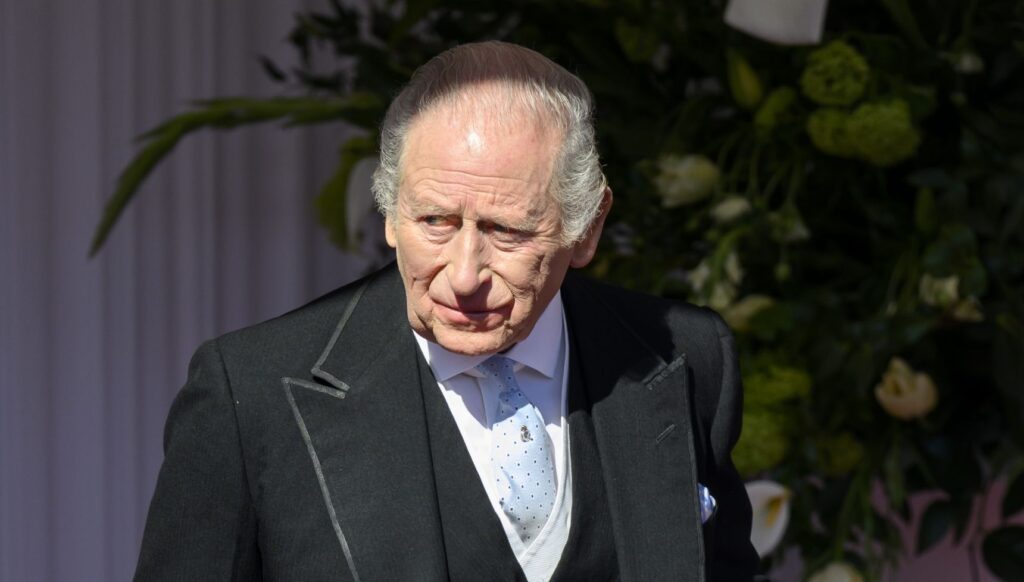 King Charles frowning during state visit