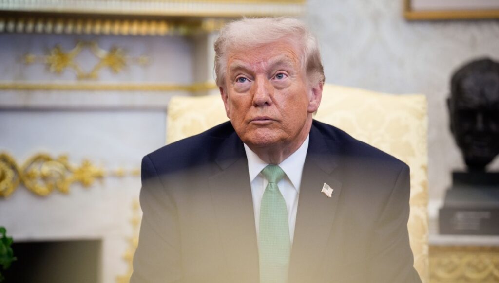 Donald Trump sitting down