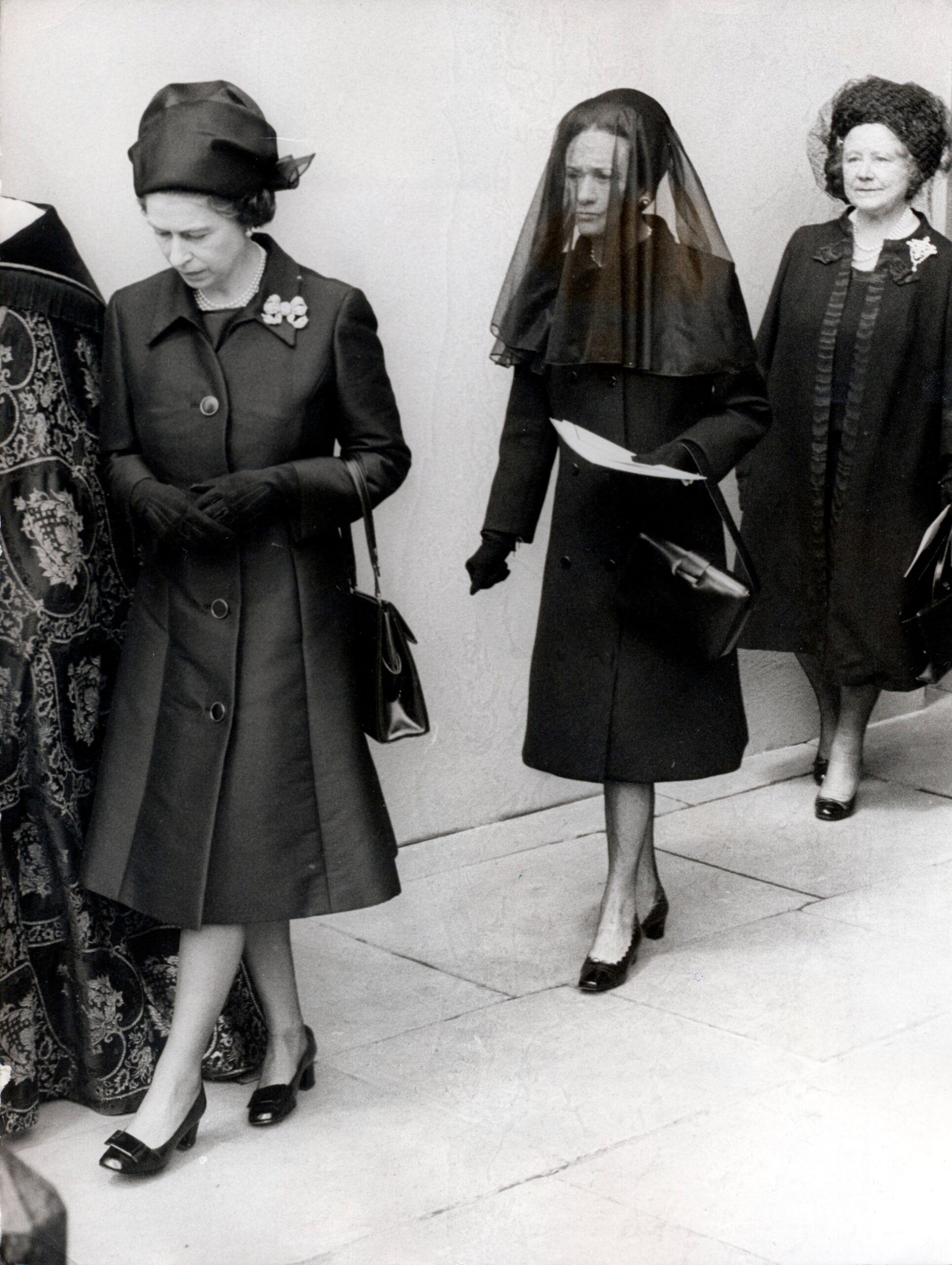 Queen Elizabeth, Wallis Simpson wearing a black veil and the Queen Mother at the funeral of Edward VIII 
